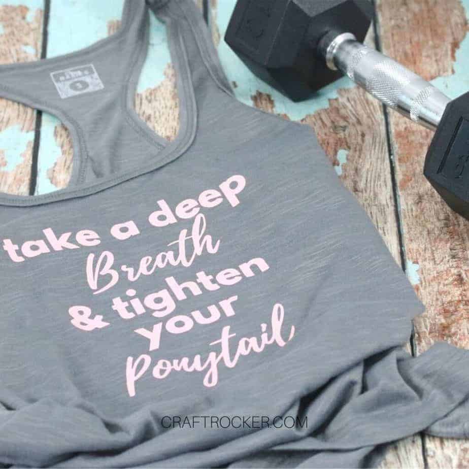 Motivational-Workout-Tank-Top-next-to-Barbell-Craft-Rocker-1024x1024