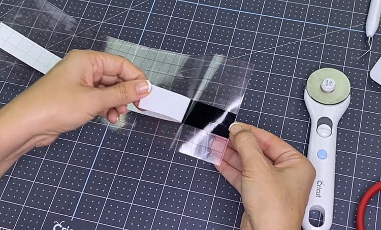 Pulling the backing off the adhesive vinyl