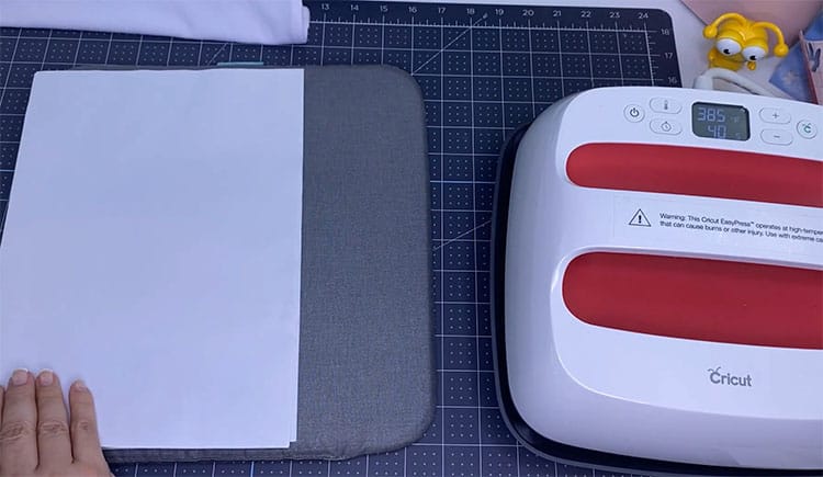 Place printer paper on heat mat