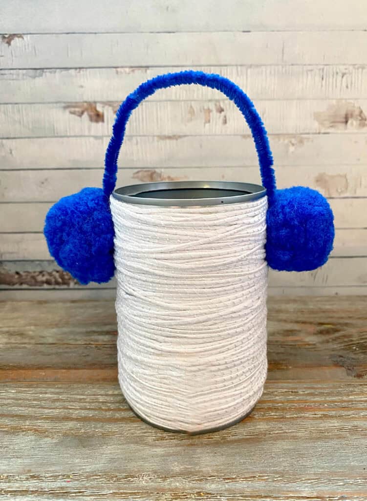 Tin Snowman wrapped with Headphones