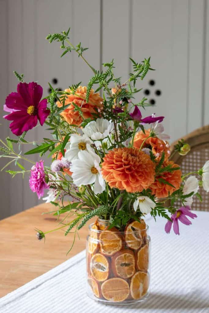 DIY Fall Centerpiece with Flowers and Dried Fruit by the Honey Comb Home