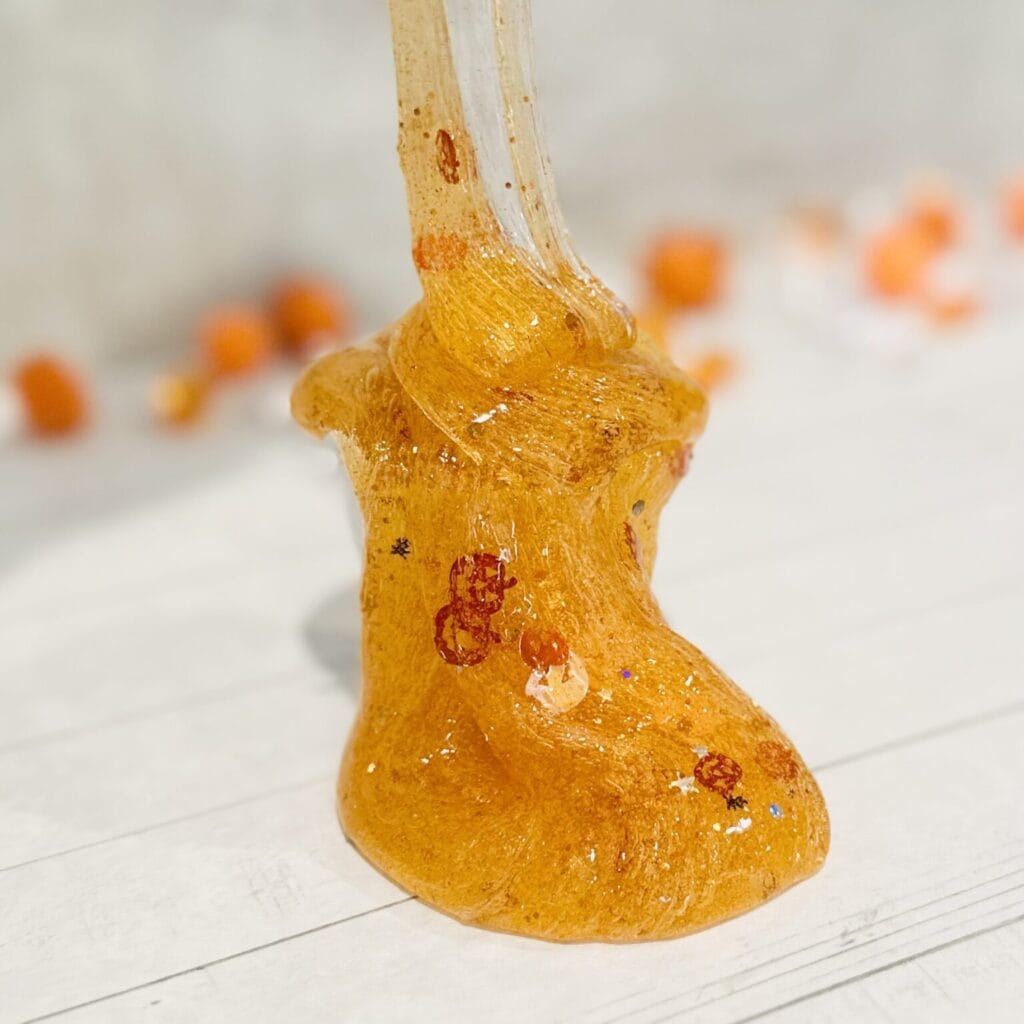 Glittery Pumpkin Slime by raising wild things sensory