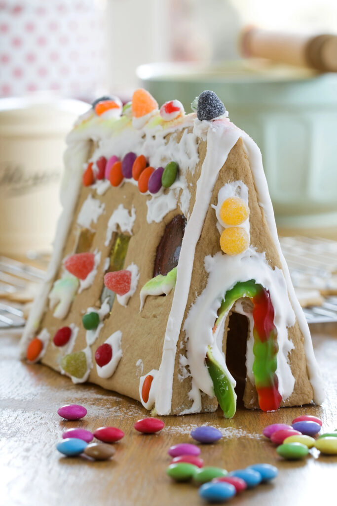 Whimsical Leaning Gingerbread House with Smarties